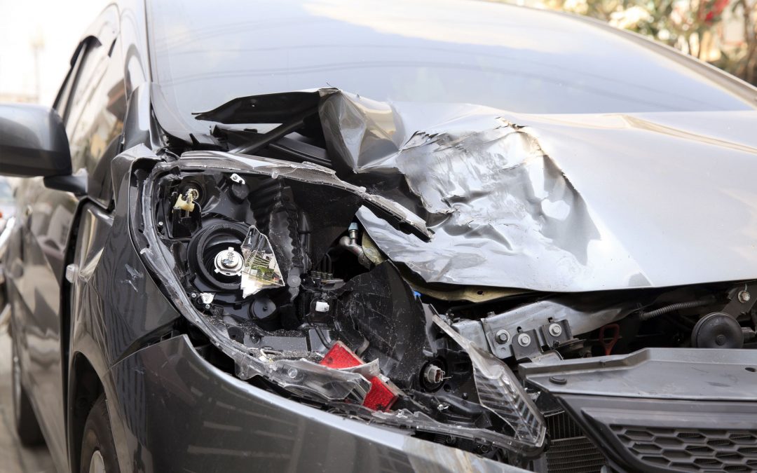 A damaged car needing aluminum repair
