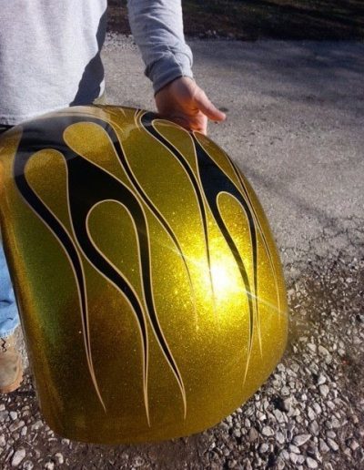 Close up of custom gold and black motorcycle paint