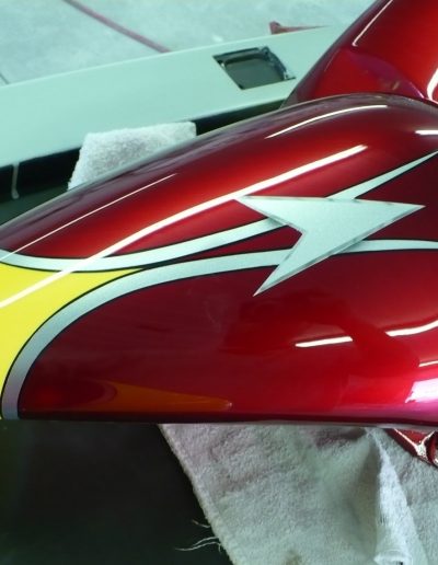 A custom painted yellow and red motorcycle